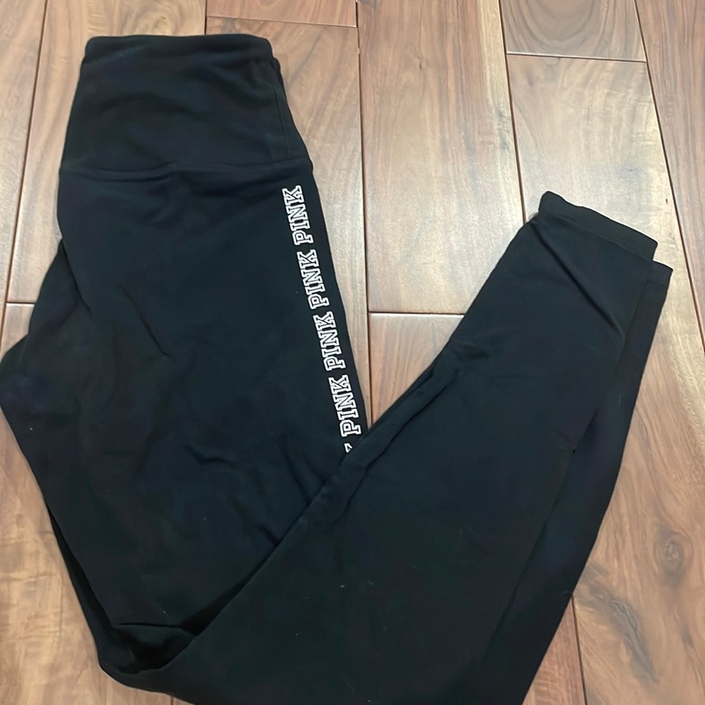 Black leggings with brand mark on sides